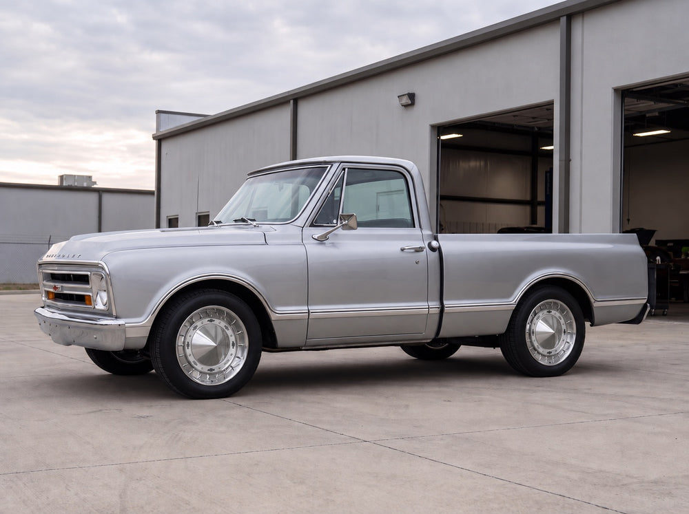 C10, outside the shop with 55 Hubcap Wheel wheels