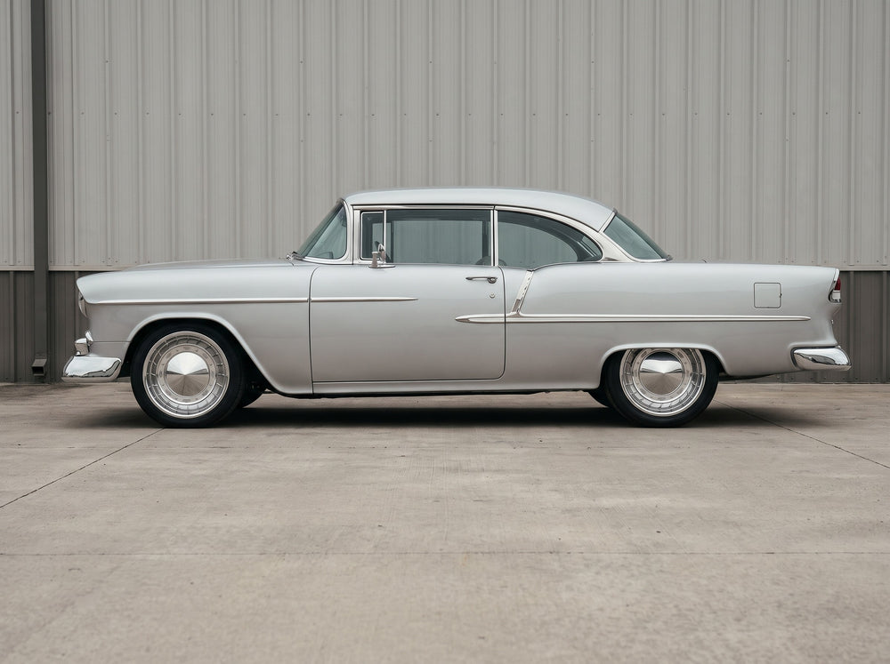1955 Bel Air, outside the shop with 55 Hubcap Wheel wheels